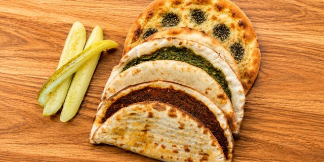 Three Sâj Flatbreads With Pickles