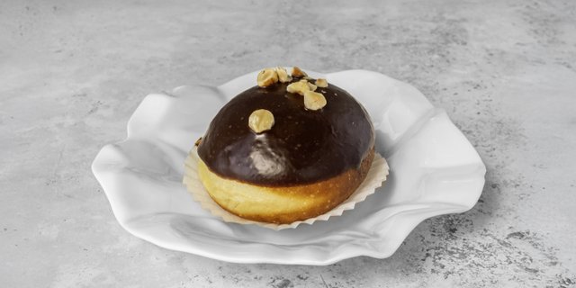 Chocolate Glazed Donut w/ Hazelnuts