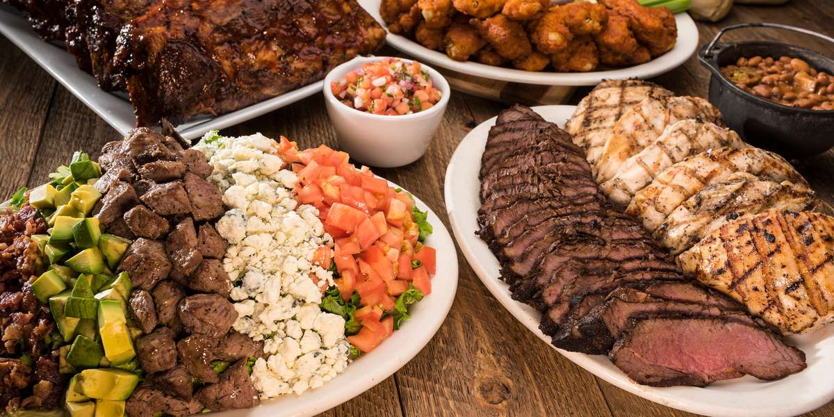 We offer saloon favorites that are sure to take you to the wild West. Share an appetizer of our sizzling steak bites, our classic slow-roasted tri-tip steak, or our raspberry chipotle-glazed ribs. With real steakhouse eats, we know you'll get a true taste of the West.  - Cool Hand Luke's Steakhouse