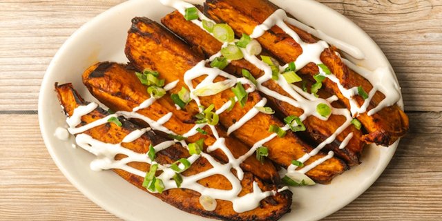 Roasted Sweet Potatoes With Sour Cream & Scallions
