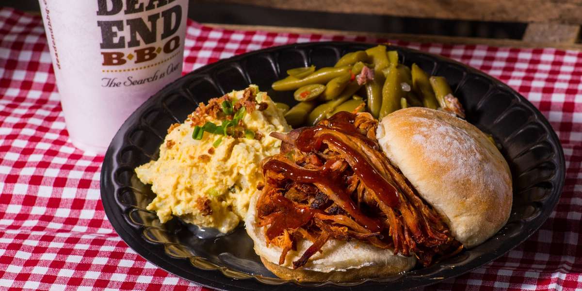 We offer neighborhood-style BBQ. Our food is designed for you to experience the smells, the sounds, and the homemade tastes of an exceptional American neighborhood barbeque in Knoxville, Tennessee. - Dead End BBQ