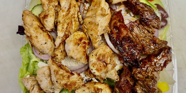 Chicken & Steak Tips over Garden Salad