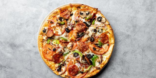 Picasso’s Masterpiece House Deluxe Pizza