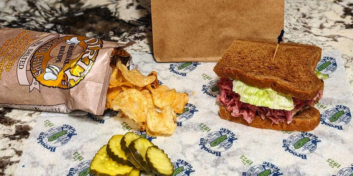 Brine and dine your office with our famous Brooklyn pickles! We're known in the community for serving up the best lunch. Every expertly crafted, award-winning sandwich is accompanied by a perfect pickle, a favorite in Syracuse for over 40 years.  - Brooklyn Pickle