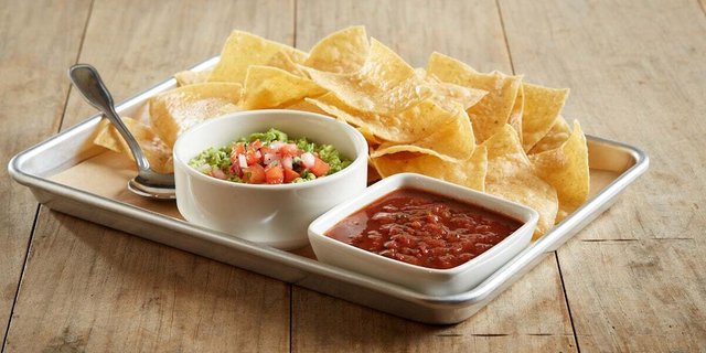Individually Packaged Chips & Housemade Guacamole + Salsa
