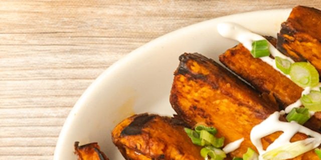 Roasted Sweet Potatoes With Sour Cream & Scallions